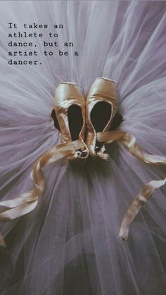 a pair of ballet shoes sitting on top of a tulle covered floor with the words it takes an athlete to dance, but an artist to be a dancer