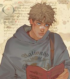 a boy with blue eyes is reading a book