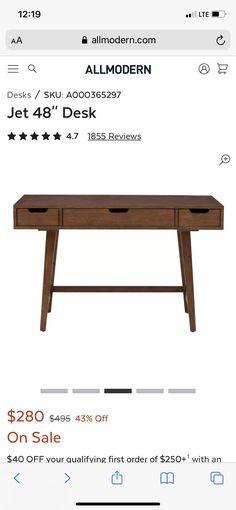 a wooden desk with three drawers on sale