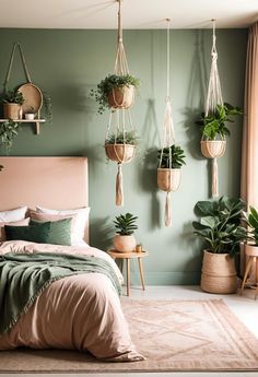 a bedroom with green walls and hanging plants