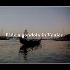 a boat floating on top of a body of water with the words ride a gondola in venice