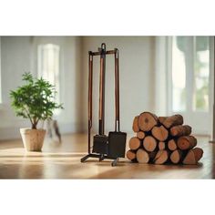 a pile of wood sitting on top of a wooden floor next to a firewood log holder