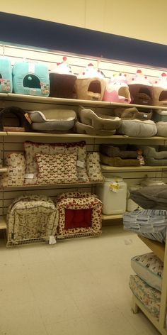 the shelves are filled with many different types of pillows