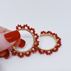 Beautiful Red Seed Beads were carefully wrapped around gold hoops with gold wire.  These, beautiful, hoop earrings are in 30mm (1 inch) diameter. (Please see the pictures that include a tape measure and a quarter for size reference.)  These earrings will quickly elevate any outfit! Cotton Filled Box Included. Handmade in the USA. --------  Find more Beautiful Pieces at AshbeesAccessories 🛍 Gemstone Necklaces: https://www.etsy.com/shop/AshbeesAccessories?section_id=24082817 Necklaces: https://www.etsy.com/shop/AshbeesAccessories?section_id=23201100 Gemstone Bracelets: https://www.etsy.com/shop/AshbeesAccessories?section_id=24071970 Bracelets: https://www.etsy.com/shop/AshbeesAccessories?section_id=23355728 Gemstone Earrings: https://www.etsy.com/shop/AshbeesAccessories?section_id=24071982 Gold Beaded Metal Hoop Earrings As Gift, Adjustable Hoop Earrings With Gold Beads As Gift, Adjustable Gold Beads Hoop Earrings As Gift, Red Wire Wrapped Hoop Earrings, Small Hoop Earrings With Gold Beads As A Gift, Adjustable Gold Beaded Hoop Earrings As Gift, Gold Beaded Hoop Earrings Gift, Festive Red Hoop Earrings, Teal Bracelet