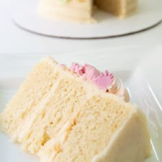 a piece of cake sitting on top of a white plate next to a slice of cake