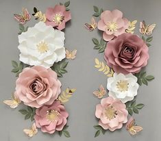 paper flowers and butterflies on a gray background