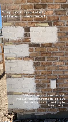 a brick wall that has been painted white with some writing on it and the words, they look completely different over here