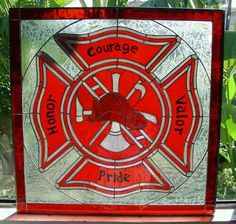 a firefighter's badge is shown on a stained glass block that reads, courage, hope, and pride