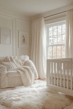 a baby's room with a white crib, window and rug on the floor