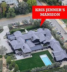 an aerial view of a house with a large pool in the middle and a red sign that says kris jenny's mansion