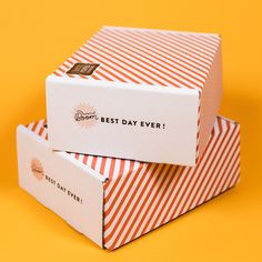 two boxes are stacked on top of each other, one has the word best day ever written on it