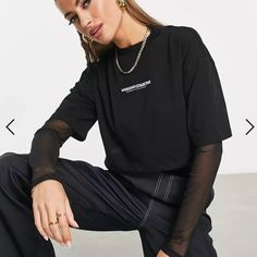 Crew Neck Crop Boxy Relaxt Fit Tee Logo Print On Chest Mesh Sleeve And Mesh Shirt Underneath Jersey: Soft And Stretchy Main: 100% Cotton, Inner: 100% Polyester. Body Length From Hps: 15.25" Chest (1" Below Armhole): 20" Neck Opening: 5.75" Neck Drop: 1.5" Nwot Trendy Graphic Print Tops For Layering, Trendy Black Crew Neck Cropped T-shirt, Trendy Black Cropped T-shirt With Crew Neck, Layered Long Sleeve T Shirt, Black Shirts Women, Black Mesh Top, Layered Long Sleeve, Layered T Shirt, Asos Tops