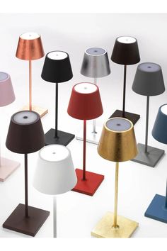 many different colored lamps are on the floor