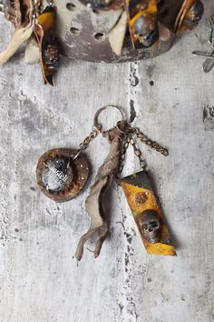 an old rusty keychain with two pieces of metal hanging from it's sides