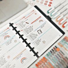 an open planner sitting on top of a table