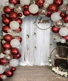 red and white balloon arch with love sign