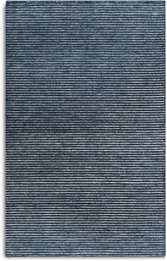 a blue rug with horizontal stripes on it