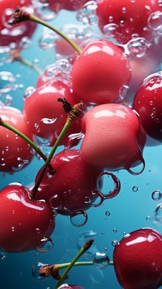 some cherries are floating in the water and have been washed with soapy bubbles