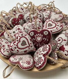 decorative heart shaped ornaments on a wooden plate