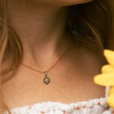 The Daisy Pendant Necklace symbolizes weathering life's storms like a wildflower. It represents the beauty within us and reminds us that growth happens even when we're not visibly blooming. This necklace serves as a daily reminder of your inner strength and the ability to thrive despite challenges. Inspired by the character Gemma from "How Gemma Found Her Sparkle," this necklace embodies the message of resilience and inner beauty. Just as Gemma rediscovers her sparkle, this pendant encourages th Daisy Pendant, Daisy Design, Flower Pendant Necklace, Inner Beauty, Inner Strength, Flower Pendant, Daily Reminder, Gold Plating, Daisy