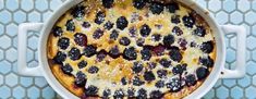 an overhead view of a blueberry cobbler in a white pot on a table