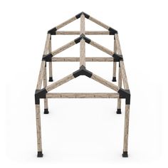 a wooden structure made out of wood and black metal bars on the top of it