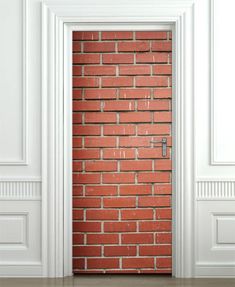 an open door with brick wall in the background