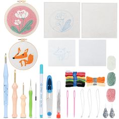 embroidery kit with scissors, needles, thread, markers and other items on white background