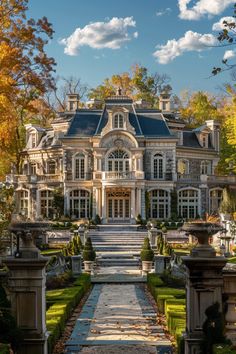 a large house with lots of windows and landscaping