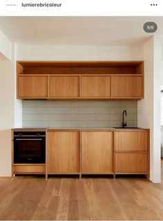 a kitchen with wooden cabinets and an oven