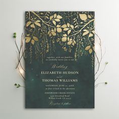 a green and gold wedding card with leaves on it