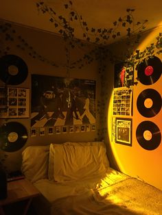 a bedroom with records hanging on the wall