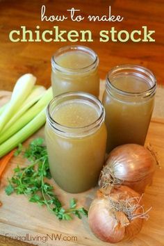 three mason jars filled with chicken stock sitting on top of a cutting board next to onions and celery