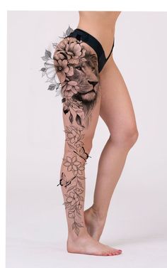 a woman's leg with flowers on it and a lion in the middle of her leg