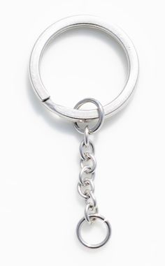 a metal keychain with a chain hanging from it's side on a white background