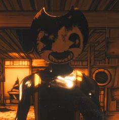 a man in a black suit with a cat mask on his head standing next to a fire place