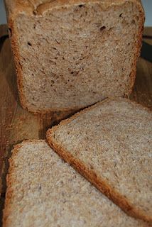 slices of bread sitting on top of a wooden cutting board