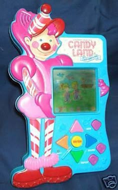 an old computer game called candy land with a clown character on the front and side