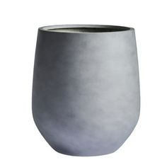 a gray vase sitting on top of a white table