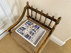 a chair with blue and white plates on it