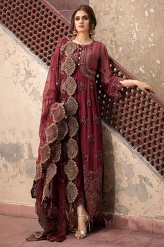 Chiffon Party Outfit in Maroon Color in Elegant Design emblazoned with thread embroidery in Pretty design. Chiffon dresses are available online at this store. You can wear these chiffon dresses on Party, Wedding and Eid events. Frock: Chiffon Party outfit frock in maroon color is embellished with copper thread hand embroidered front, back , side and neckline patch. Front and back daman is also designed with hand embroidered patch. Bottom and sleeves of the dress is embellished with embroidered h Pakistani Designer Dress, Estilo Hijab, Indian Party Wear, Pakistani Fancy Dresses, Pakistani Dresses Casual, Pakistani Fashion Party Wear, Outfits Dress, Salwar Kamiz, Pakistani Bridal Dresses