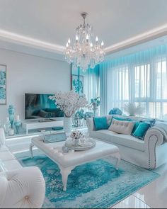 a living room filled with furniture and a chandelier