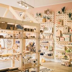 a room filled with lots of wooden shelves