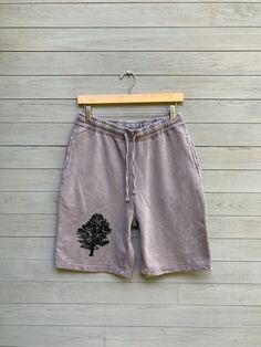 "Comfy, soft and easy GYM shorts for the guys. Shorts are grey with a drawstring waist and side pockets and 100% cotton.  small: waist 30-32\", 21\" from top of waist to bottom of leg medium: waist 32\"-34\", 22\" length large: waist 34\"-36\", 22\" length xlarge: waist 36\"-38\", 23\" length XXL: waist 40\", 23\" length shop policy: because i hand print each order once it is placed, sales are final but exchanges for any reason are welcome as long as the clothing has not been worn, washed or alt Gray Relaxed Fit Athletic Shorts, Comfortable Gray Athletic Shorts With Relaxed Fit, Cotton Gym Shorts With Relaxed Fit, Gray Cotton Workout Shorts, Gray Cotton Athletic Shorts, Gray Cotton Athletic Shorts For Loungewear, Gray Cotton Athletic Shorts For Workout, Gray Cotton Athletic Shorts With Pockets, Gray Cotton Athletic Shorts For Gym