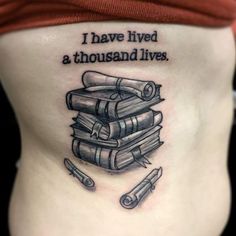 a woman with a tattoo on her stomach that says i have lived a thousand lives