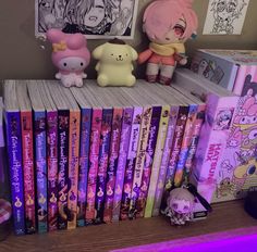 there are many anime books on the shelf