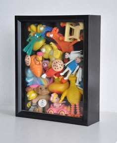 there are many toys in the shadow box