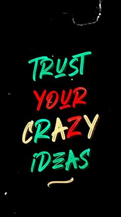 the words trust your crazy ideas written in neon green and red on a black background