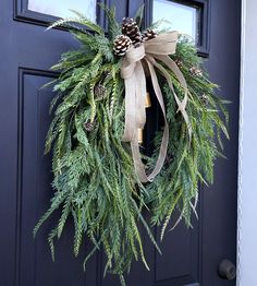 a wreath is hanging on the front door