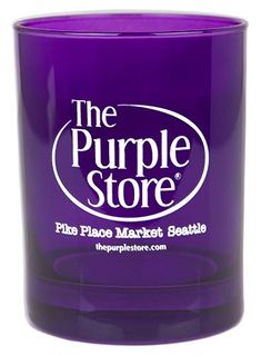 the purple store glass candle is shown on a white background and has an oval logo